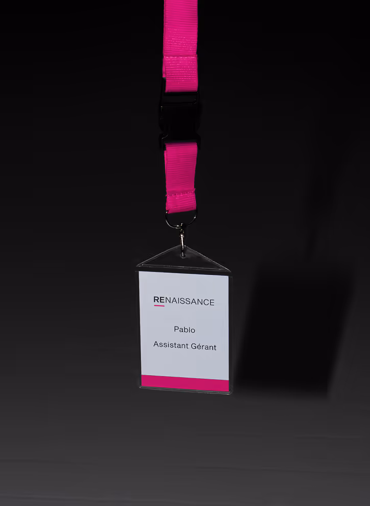 Mockup from Maison Mockup - ID badge with pink lanyard, labeled Renaissance, Pablo, Assistant Gérant on white card.