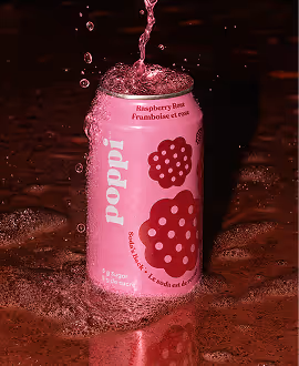 AI Generated image with ChatGpt - Pink can of Poppi Raspberry Drink with water splashing over it on dark background.