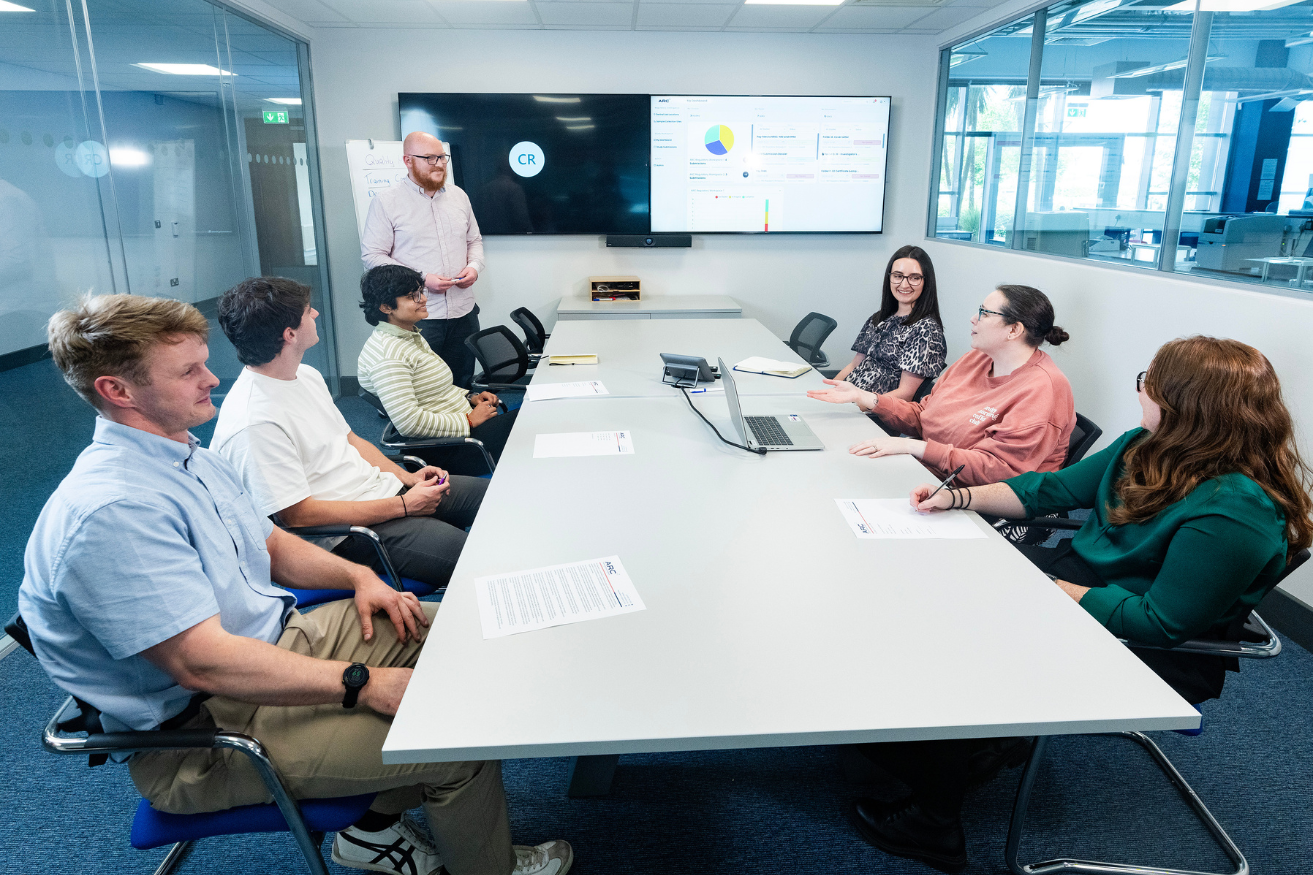 [background image] image of a workplace setting (for an ai healthcare company)