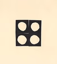 Black square divided into four parts, each containing an irregular white circle, on a beige background.