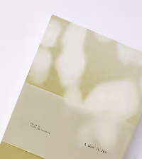 Light green book titled 'A Year in Tea' with a soft abstract cover design.