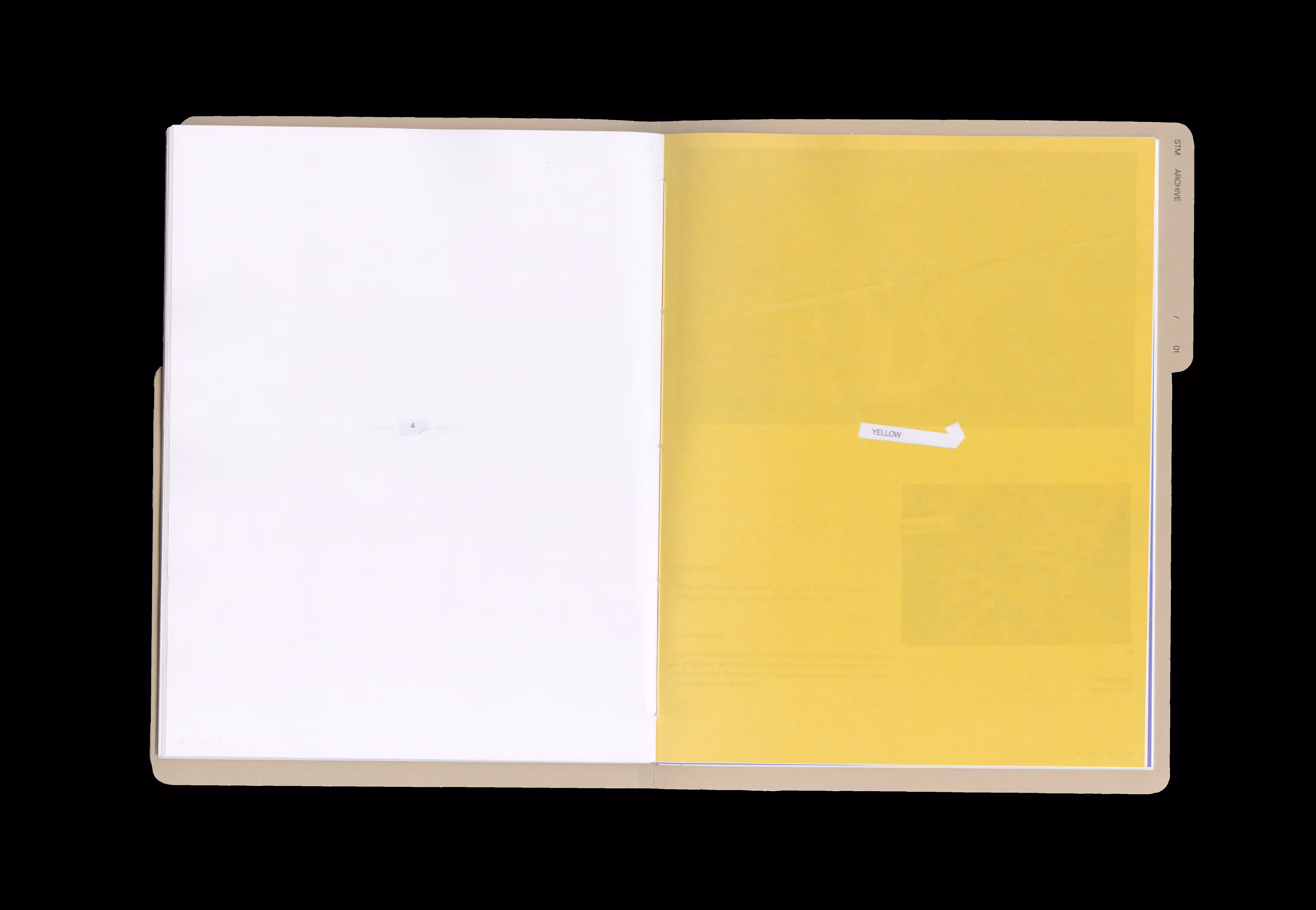 Open folder with left page blank white and right page translucent yellow labeled YELLOW with a tab STM ARCHIVE.