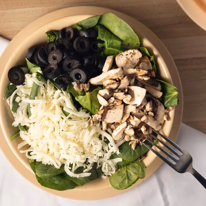 A plate of food with a fork on it.