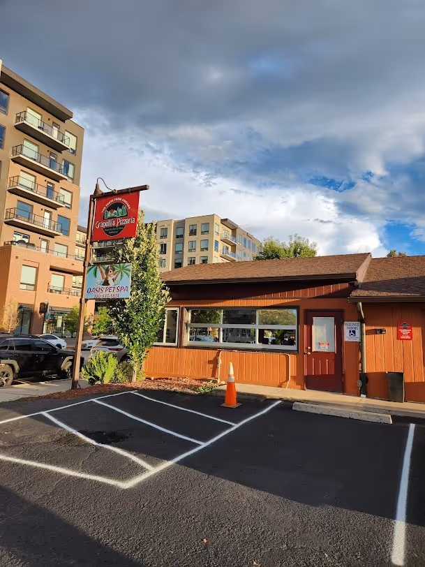 A restaurant with a sign that says "Great Pizza Place".