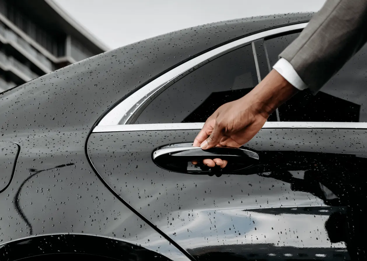 VIP greeter welcoming a passenger at Paris airport with personalised escort to the vehicle