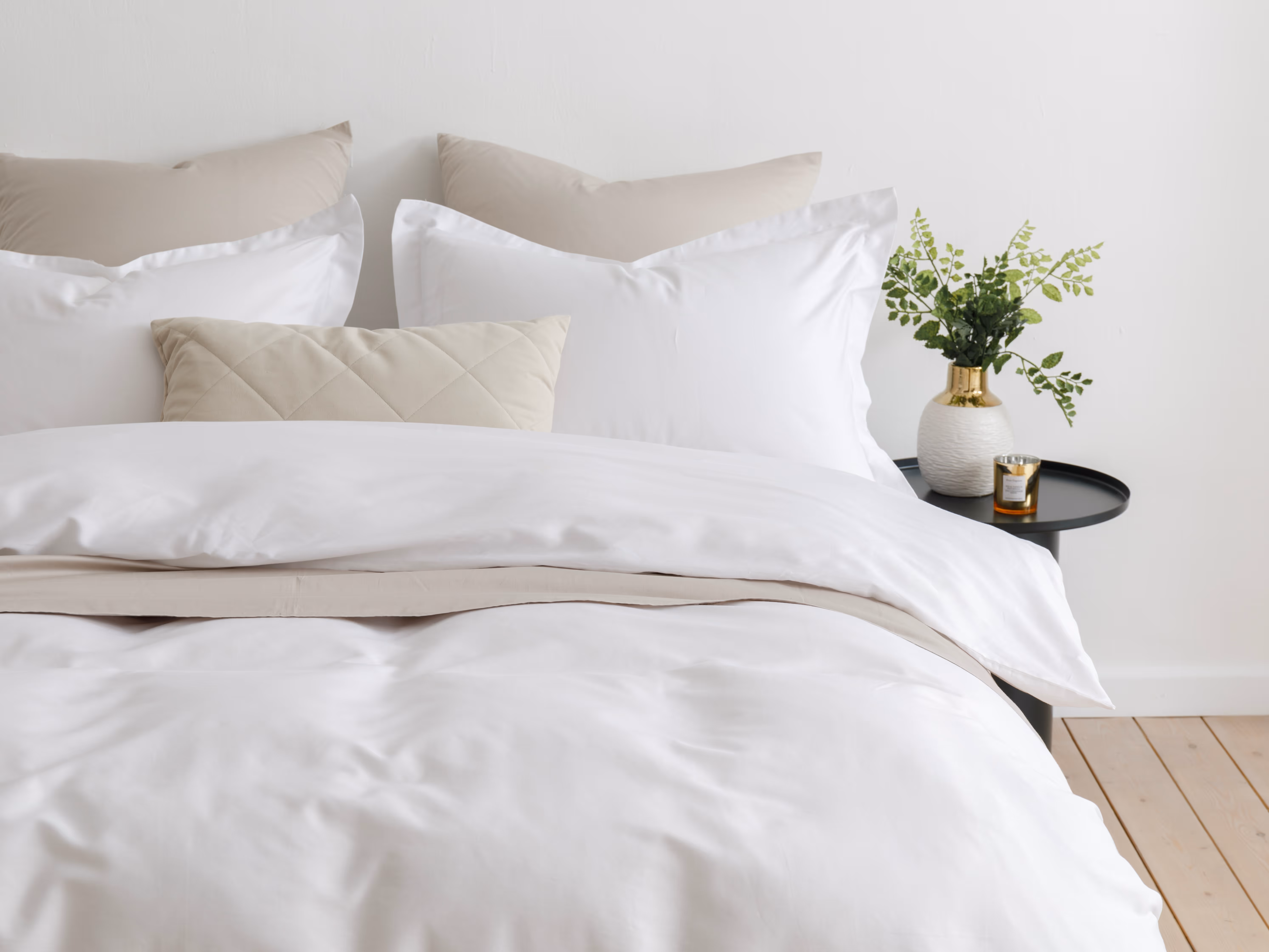 Bed with comforters and pillows stock image