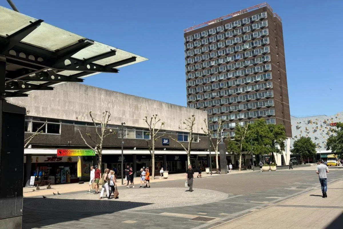 Basildon Town Square with Brooke House tower and the shopping parade on a sunny day