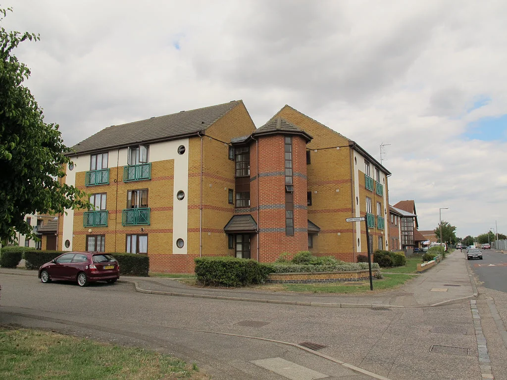Three-storey brick block of flats on a residential street in Tilbury