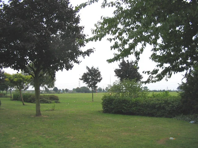 Open green space with trees and hedges in Stanford-le-Hope
