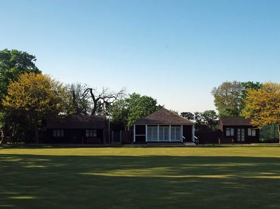 Pavilion and clubhouses beside a mown green in Orsett