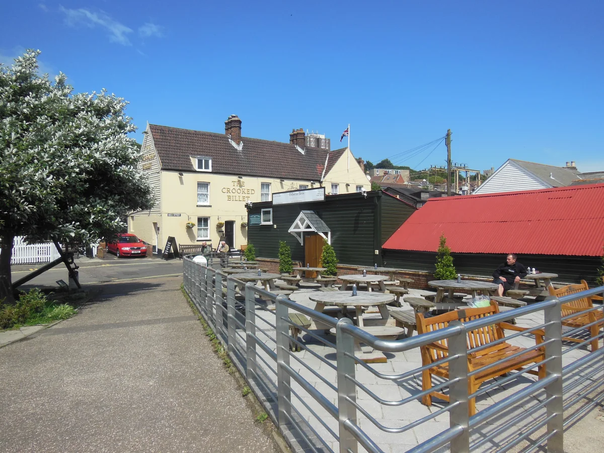 The Crooked Billet pub and outdoor seating on the High Street in Old Leigh