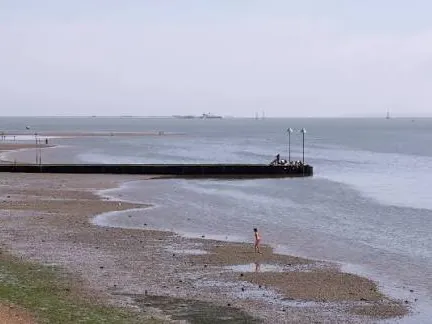 Low tide on Chalkwell beach with the long jetty reaching out into the estuary