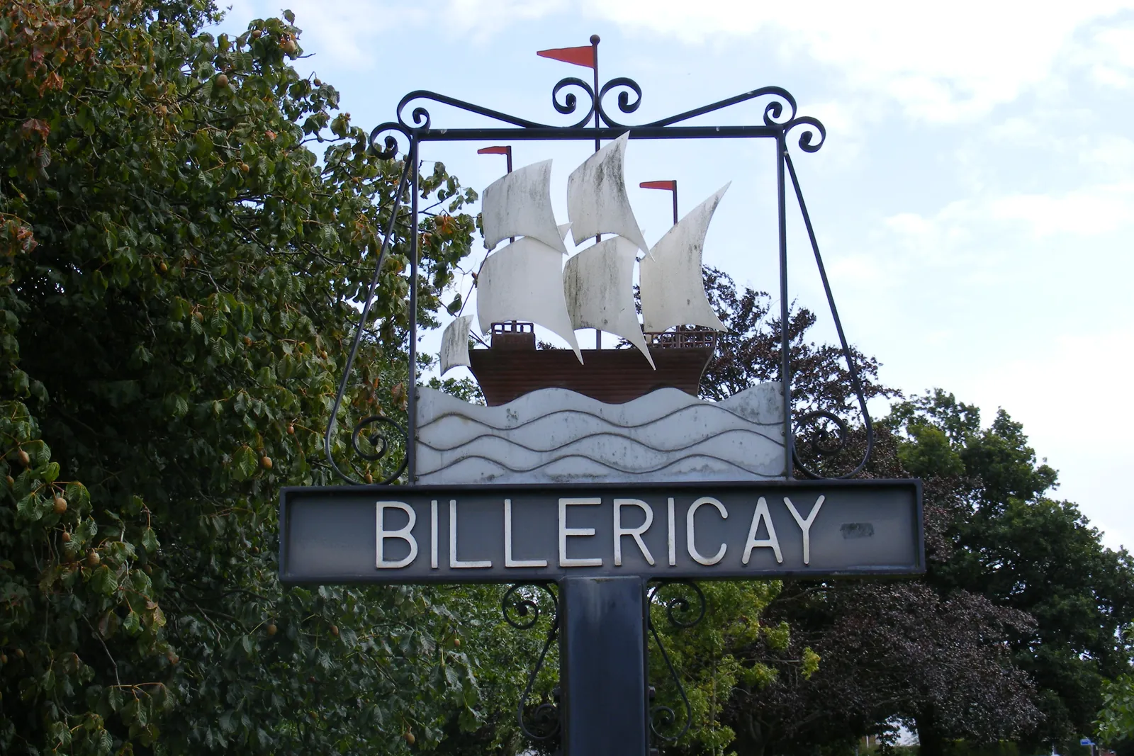 Billericay town sign showing a sailing ship above the town name