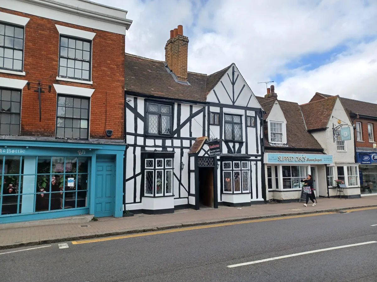Timber-framed building dated 1510 between Georgian brick shops on Billericay High Street