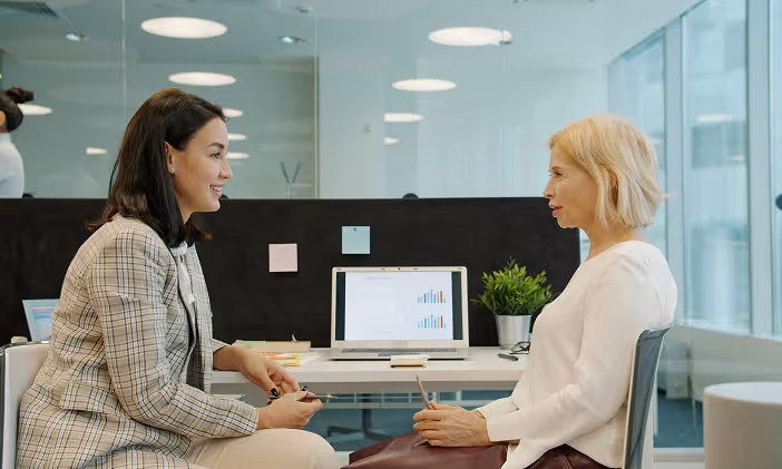 Two colleagues discussing B2B sales