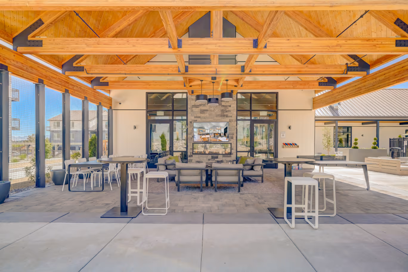 Outdoor sitting area with tables and chairs