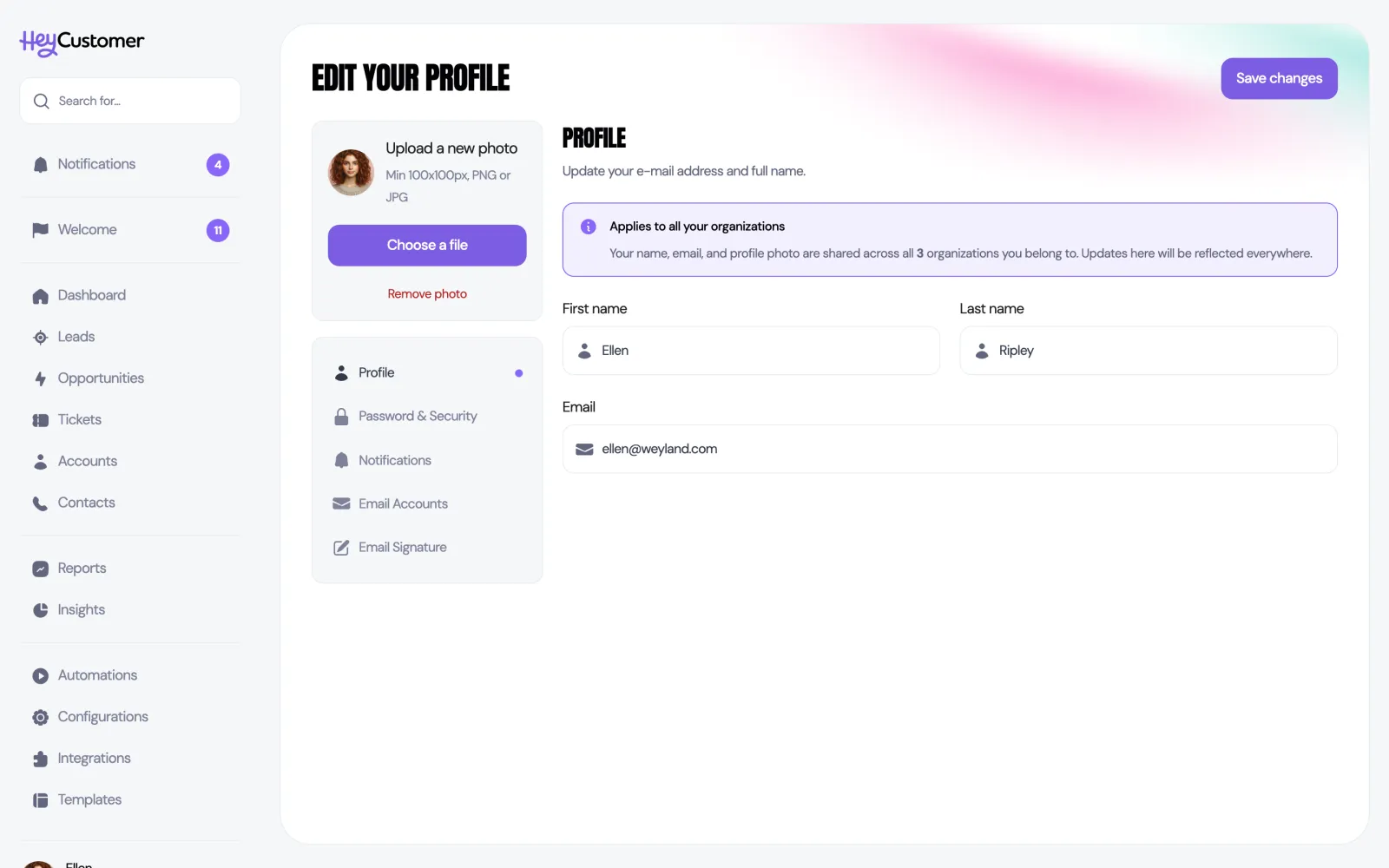 The Edit your profile page showing a highlighted notice headed Applies to all your organizations, explaining that name, email and profile photo are shared across all 3 organizations you belong to. Below the notice are First name, Last name and Email fields.