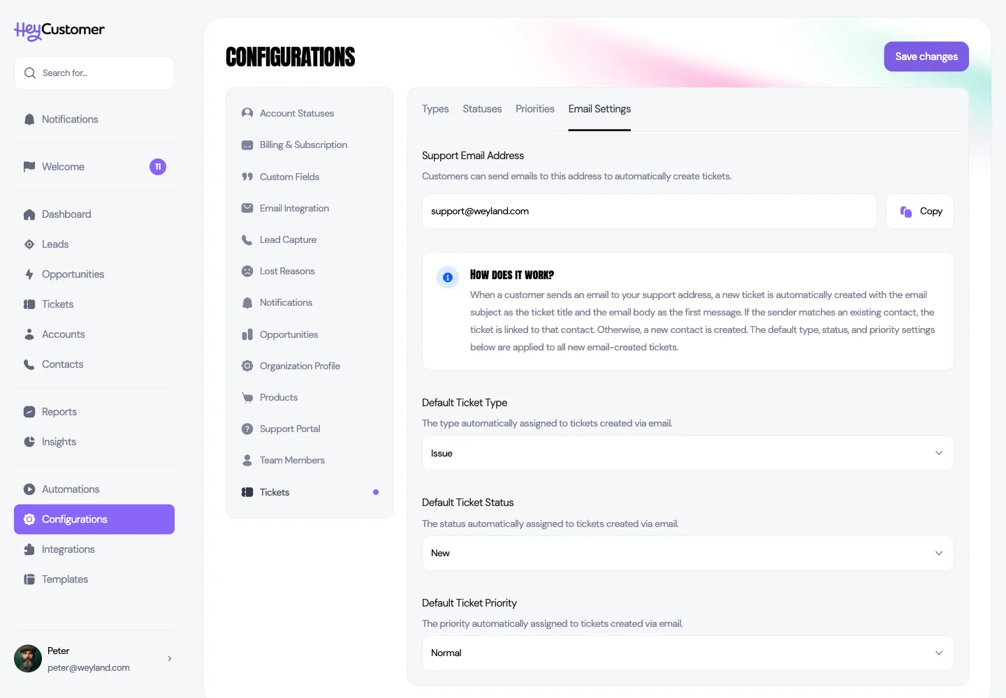 The Email Settings tab under Configurations and Tickets, showing the verified support address support@weyland.com with a Copy button, an explanation of how email tickets are created, and dropdowns for default ticket type set to Issue, status set to New, and priority set to Normal.