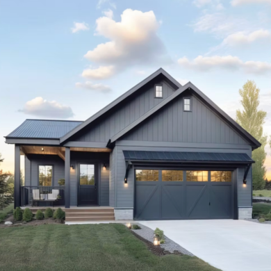 Modern single-story house with gray siding, a black roof, front porch, and garage at sunset.