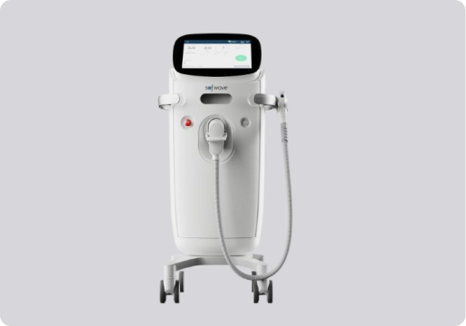 White medical device with a touchscreen display on top, a control button, and an attached handheld applicator with a cord, mounted on four caster wheels.