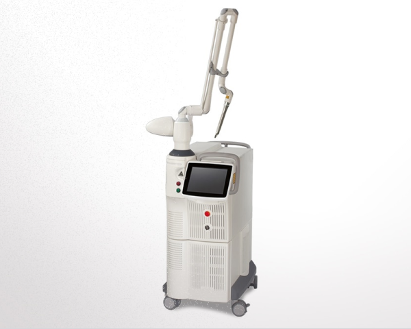 White medical laser machine with a touchscreen display and articulated arm on wheels against a white background.