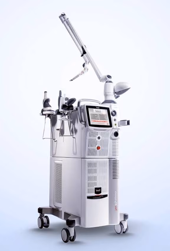Modern white medical laser machine with touch screen, multiple handpieces, and adjustable arm mounted on wheels for mobility.