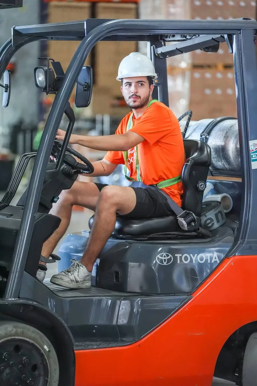 Warehouse worker operating a forklift