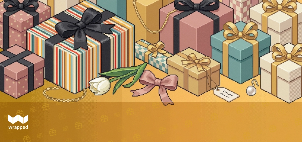A necklace in a gift box surrounded by handwritten Mother's Day cards and spring flowers