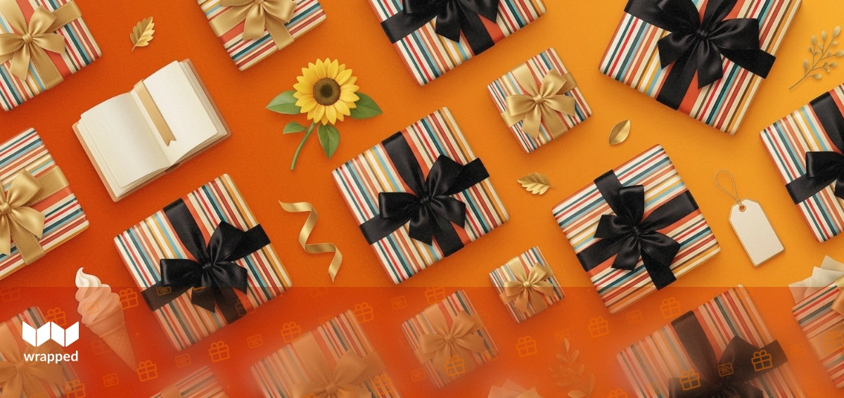 A stack of books wrapped with a ribbon beside a Father's Day card on a wooden table