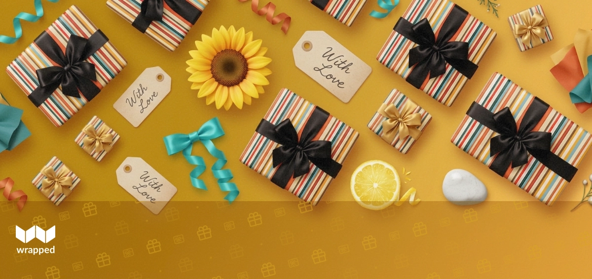 Colorful handwritten gift notes spread across a summer table with flowers and wrapped presents