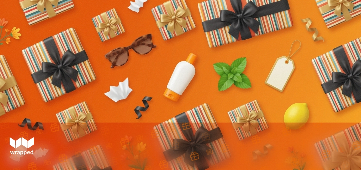 A wrapped birthday gift and baby shoes on a summer table with no holiday decorations in sight