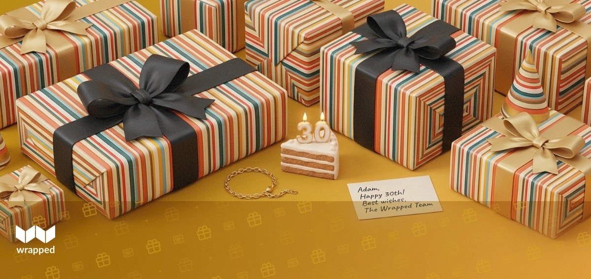 Warm golden tabletop with a numbered birthday candle, cake slice, gold bracelet and handwritten card ready for gifting