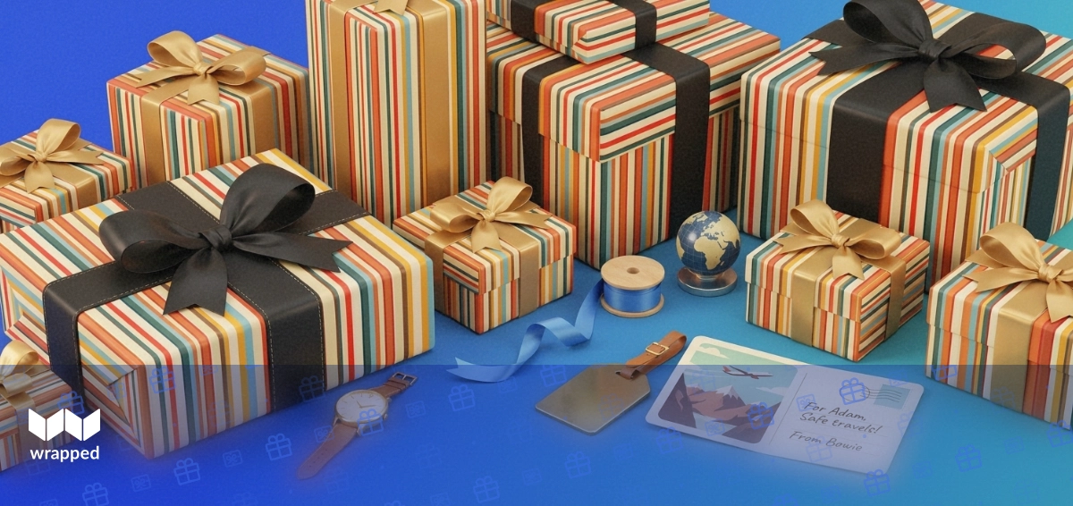 Editorial still life of a gold watch, travel postcard, globe paperweight and ribbon spool on a cool blue desk