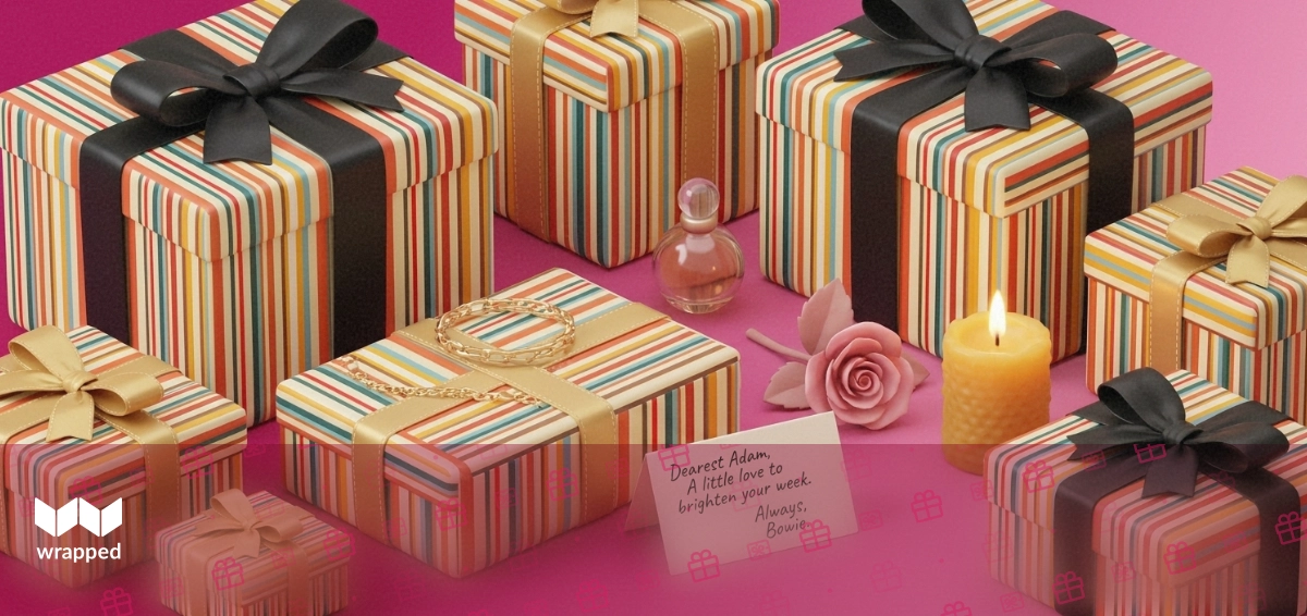 Editorial still life in rose tones with a gold bracelet, perfume bottle, handwritten message card, pink rose and lit candle
