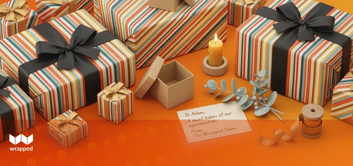 A small kraft gift box beside a handwritten message card, eucalyptus sprig and beeswax candle on a warm sunlit table