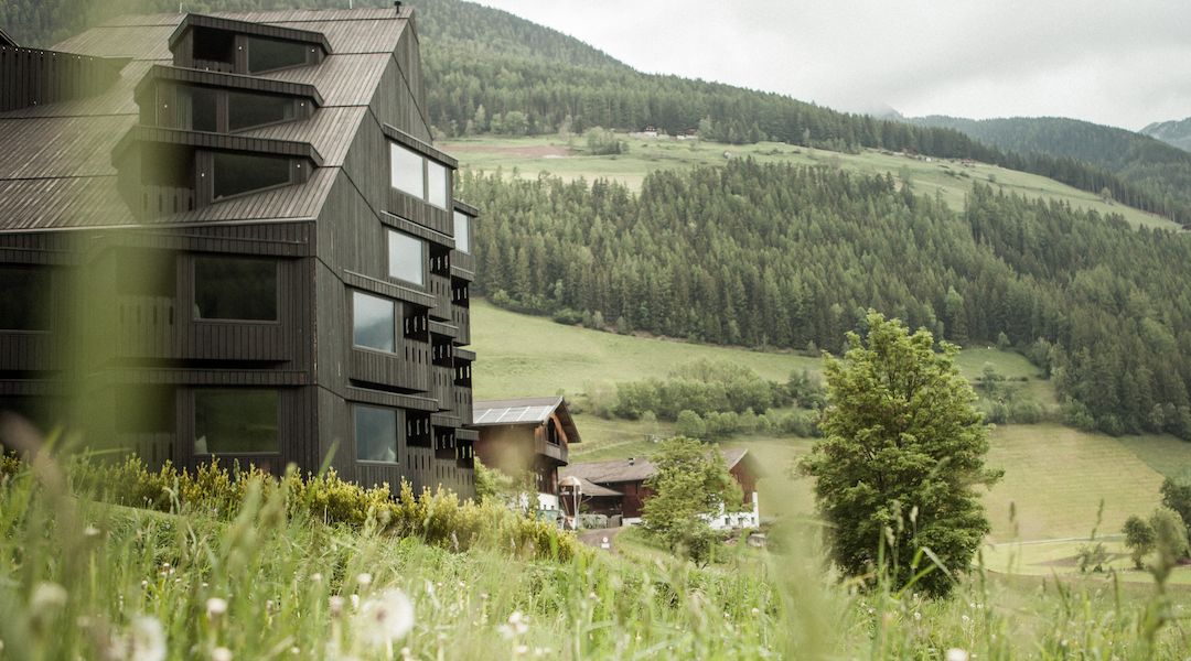 The Pedevilla wing of the Buehelwirt above St. Jakob, meadows falling away into the Ahrntal