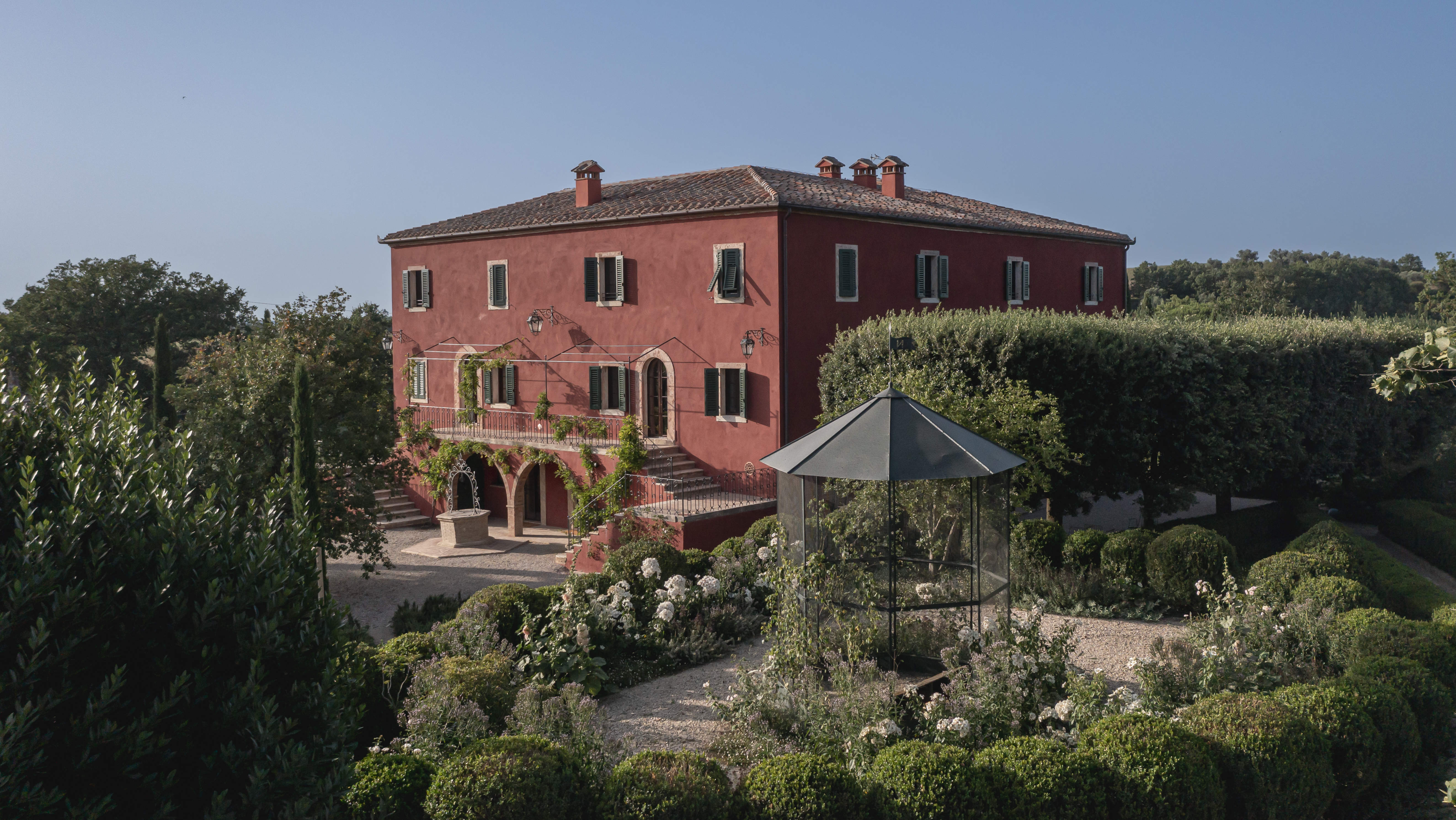 The 1846 villa at Casa Newton near Pienza, seen over its garden
