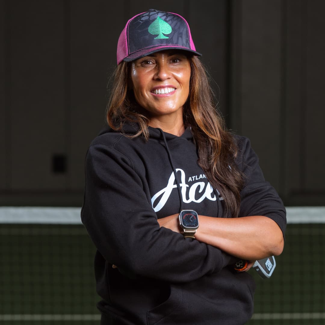 Profile picture of Natasha Linton wearing a Atlantic City Hat and hoodie with arms crossed.