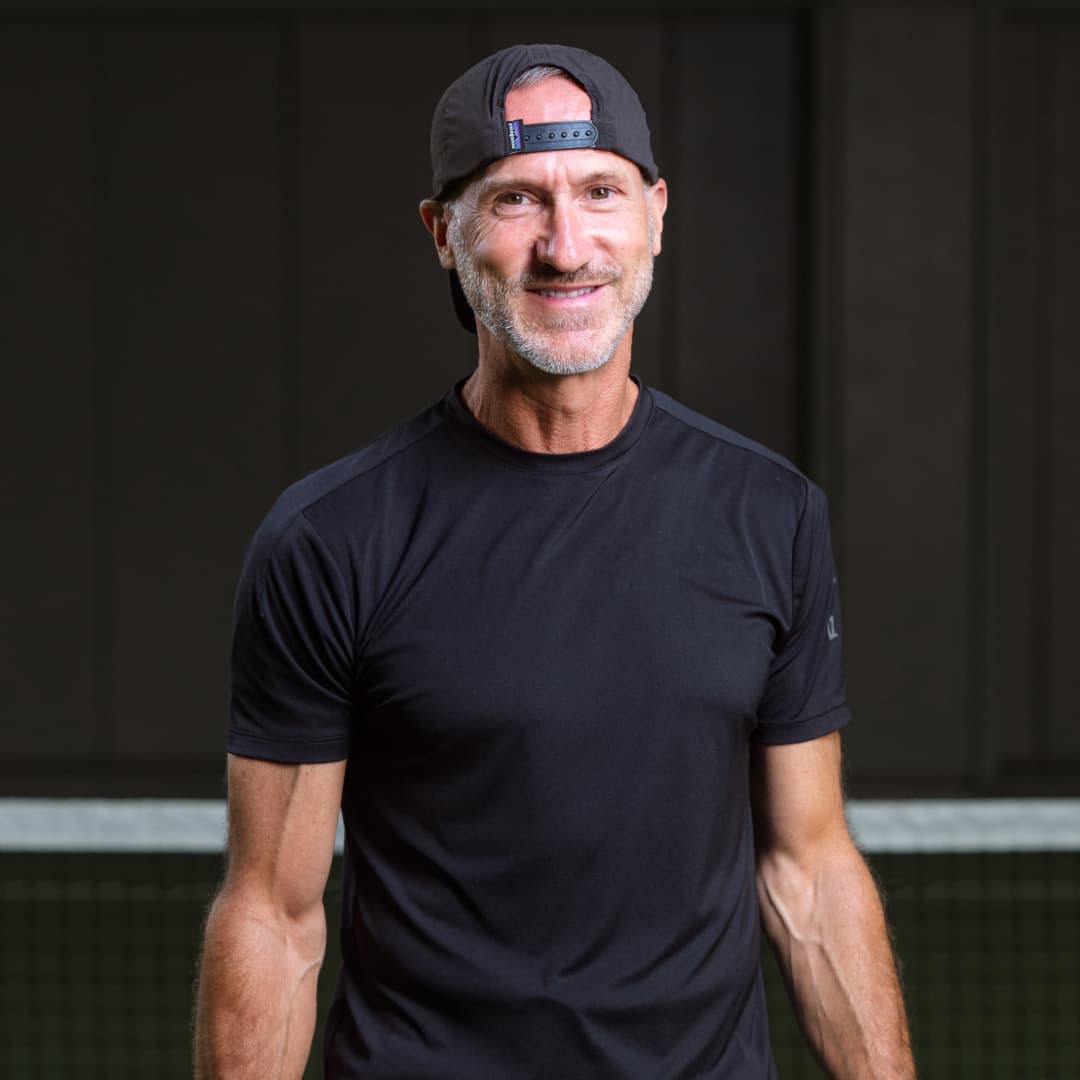 Waist up profile picture of Hugh Laroque wearing a black cap and shirt.