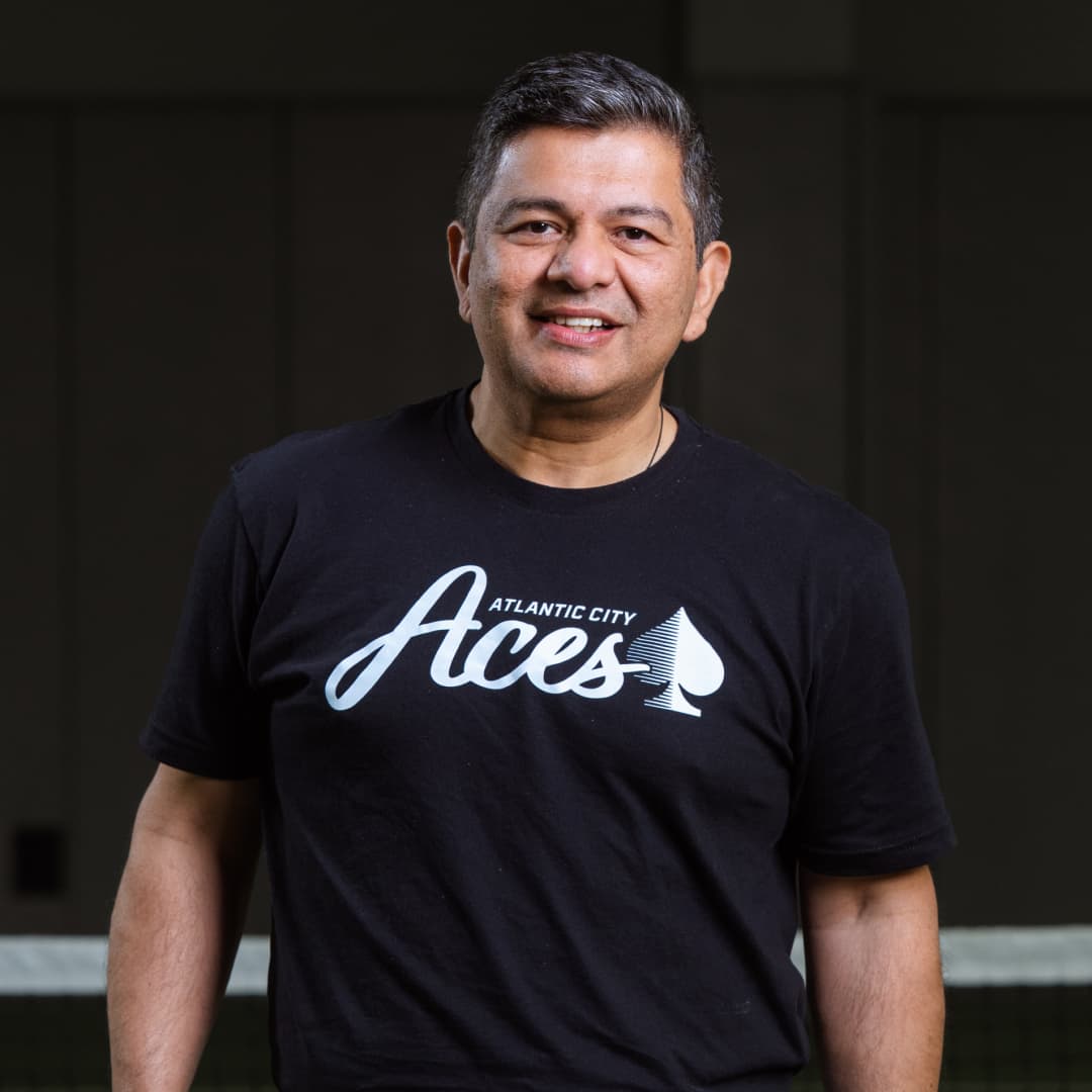 Profile picture of Vinay Bahuguna wearing a black Atlantic City Aces t-shirt.