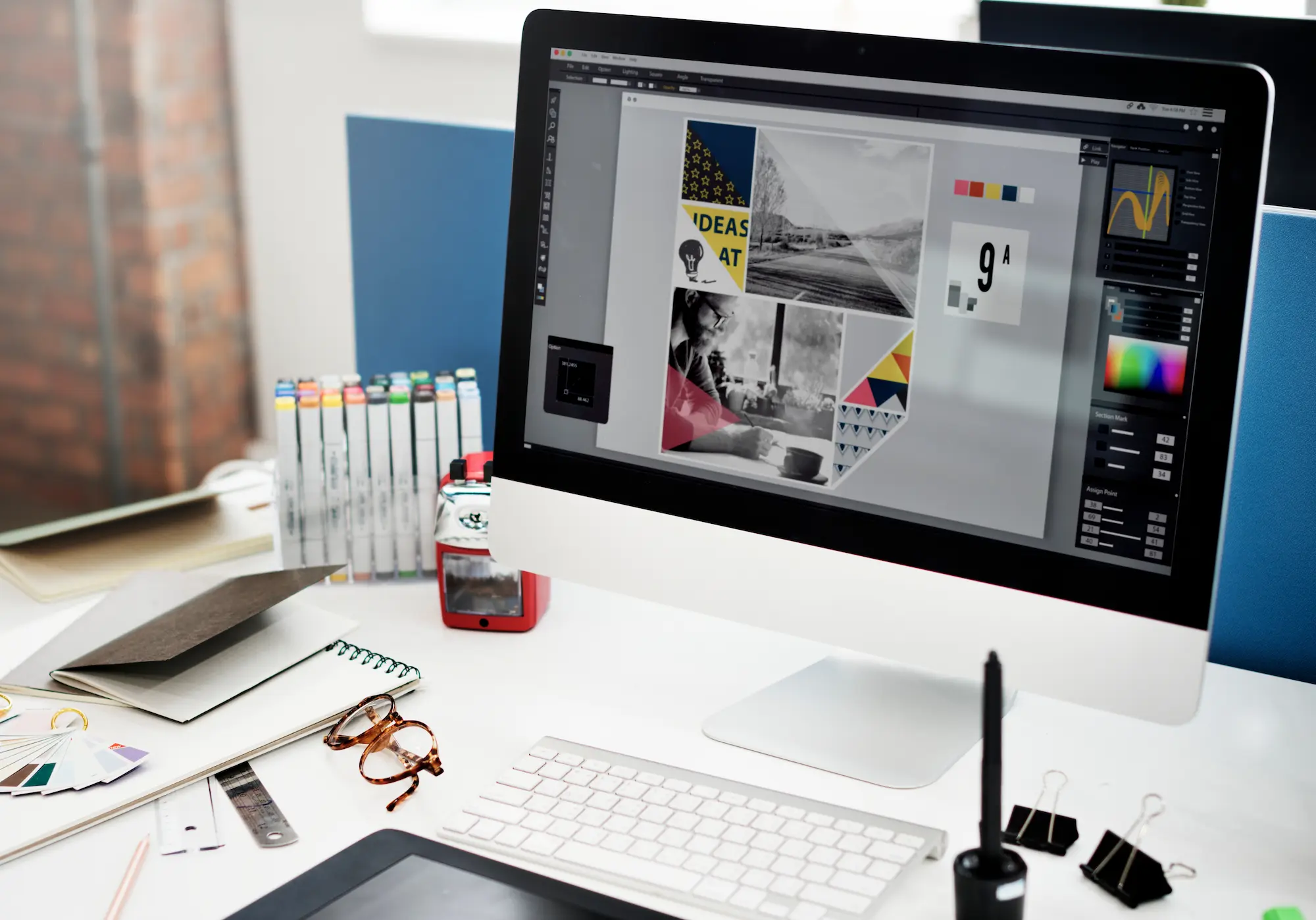 Desktop computer displaying design software with a photo mood board