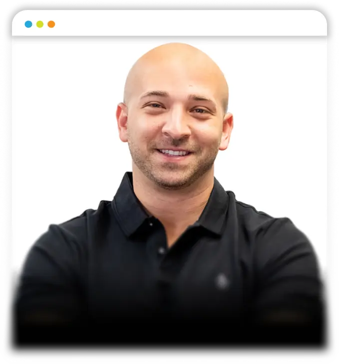 Professional headshot of a man in a dark shirt