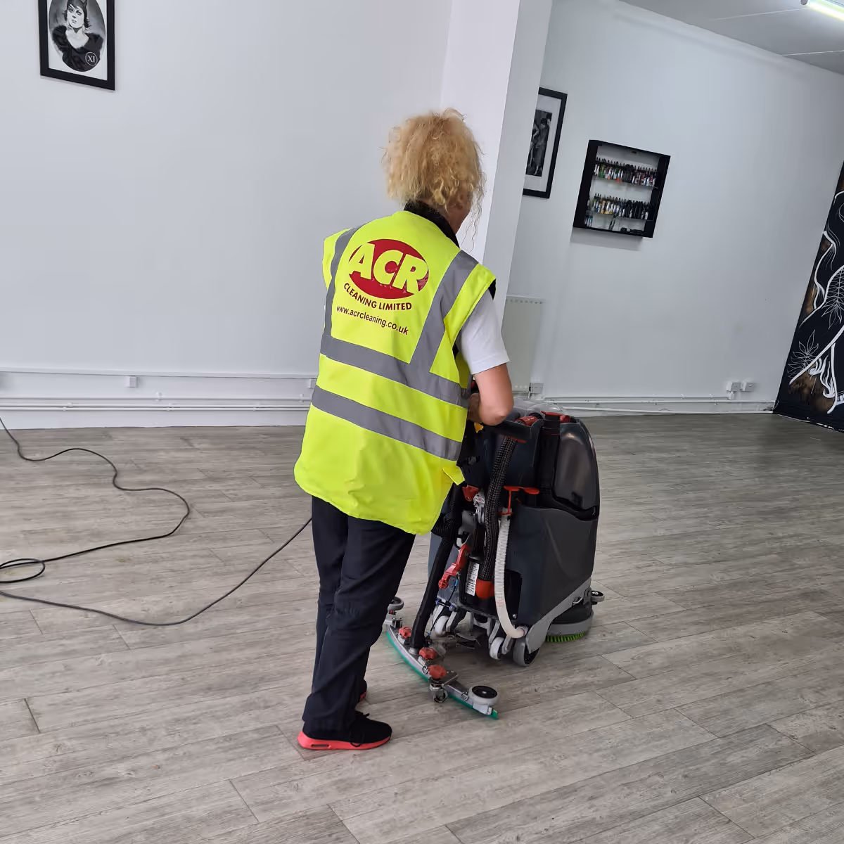 ACR Cleaning Ltd technician is providing hardwood floor cleaning for a commercial property in Huntingdon.