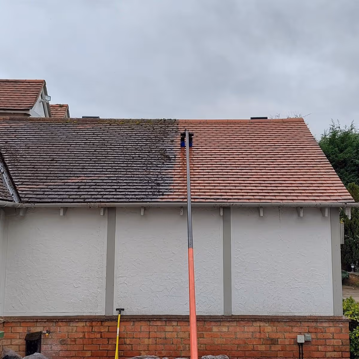 A before and after of a roof being cleaned in Huntingdon.