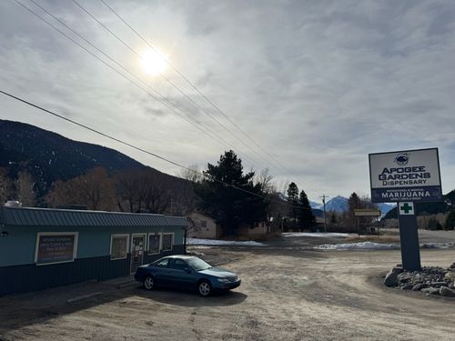 Livingston store front. Tall sign in the parking lot.