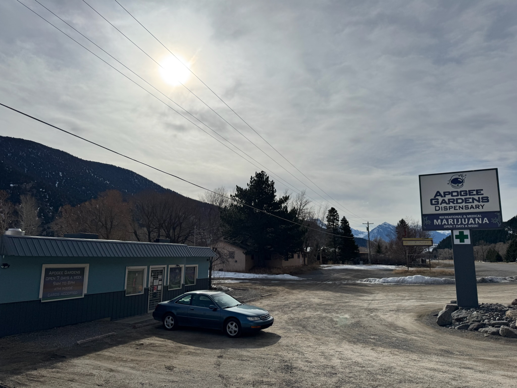 Livingston store front. Tall sign in the parking lot.
