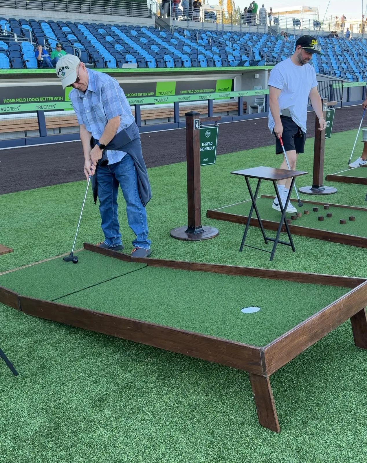 White golf ball on green artificial turf with Rex Hill Vineyards logo and text.