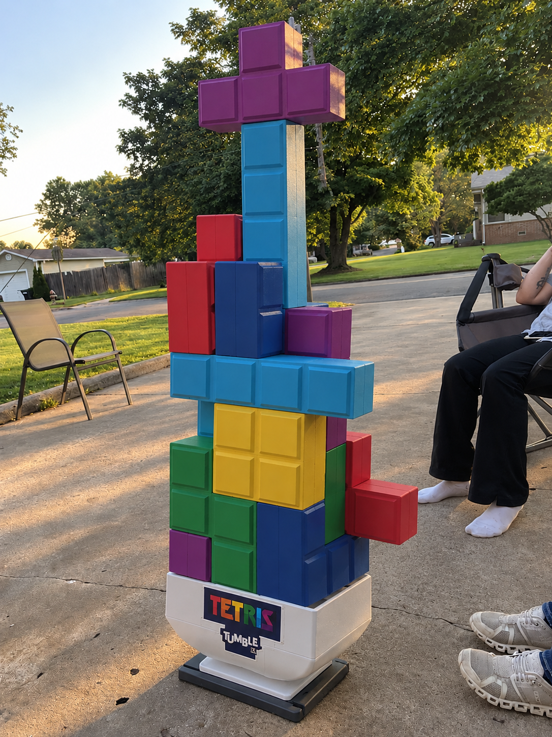 Giant Tetris Tumble yard game with colorful interlocking blocks stacked on a rocking base