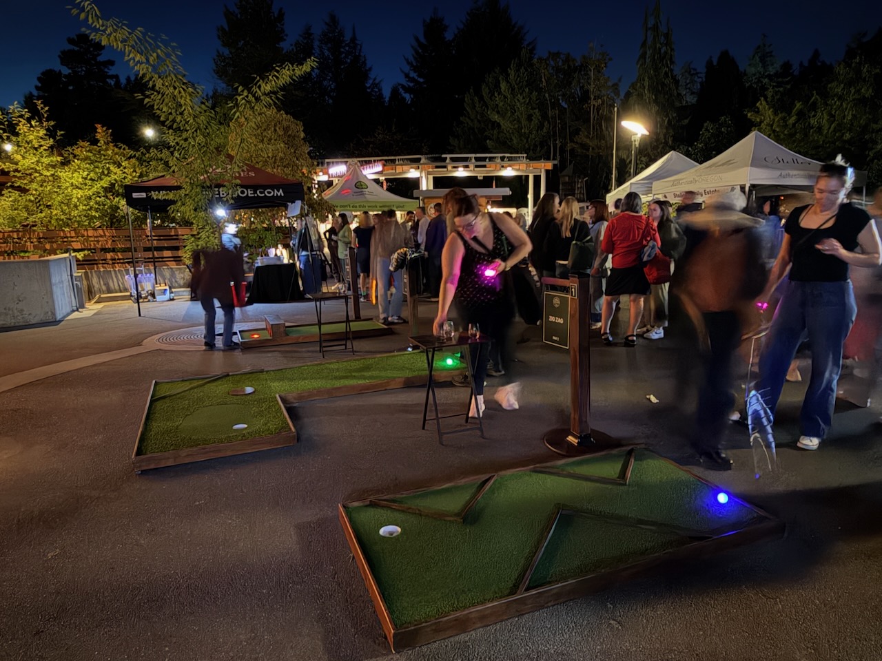 Guests playing mobile mini golf during Oregon Zoo Nights