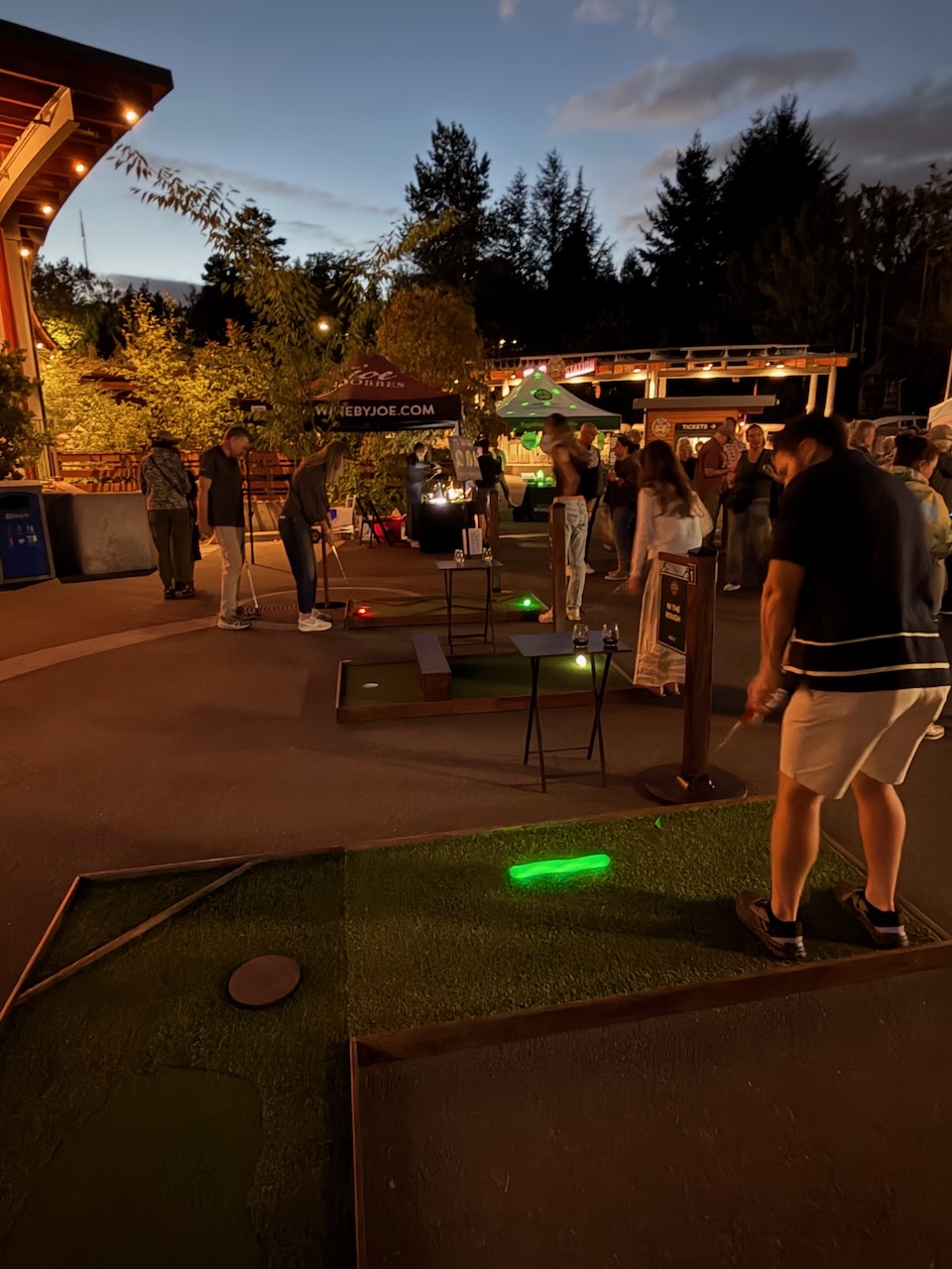 Guests playing mobile mini golf during Oregon Zoo Nights